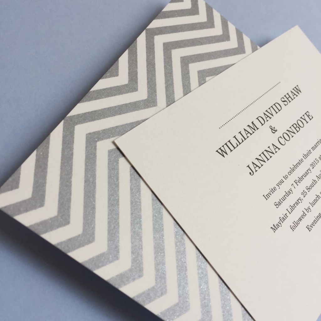 silver and white reverse printed wedding invitation