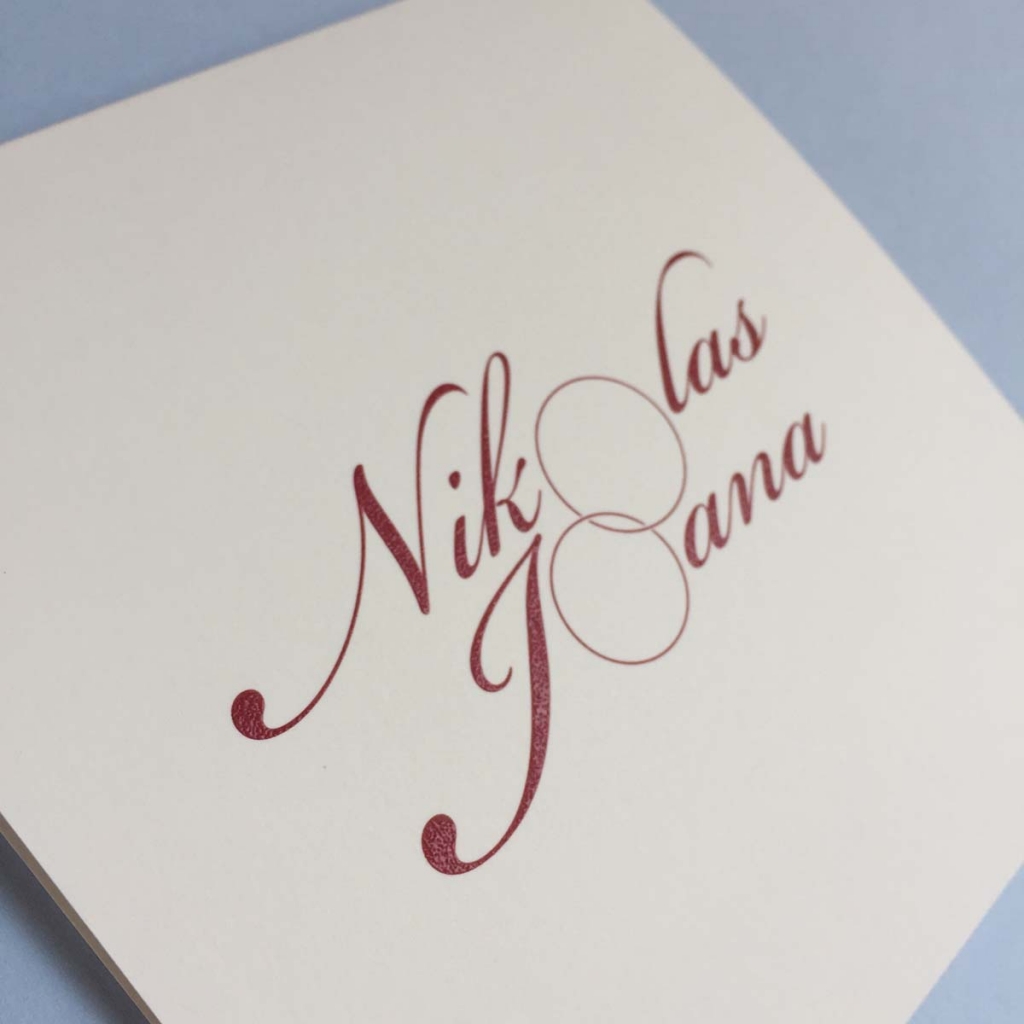 Reverse printed monogram wedding invitation