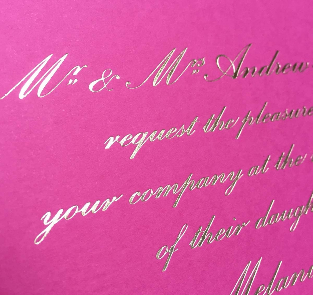 gold foiled pink wedding invitation