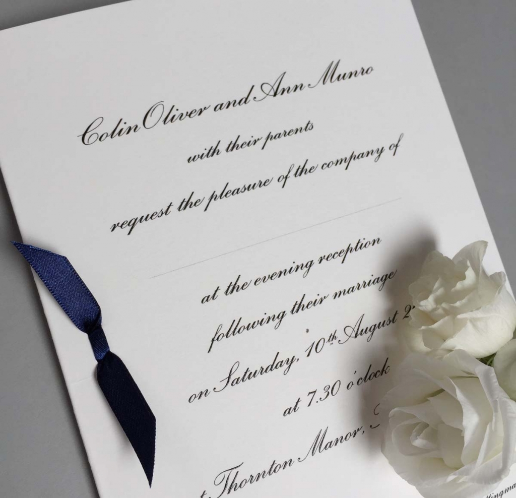 traditional wedding invitation with blue bow