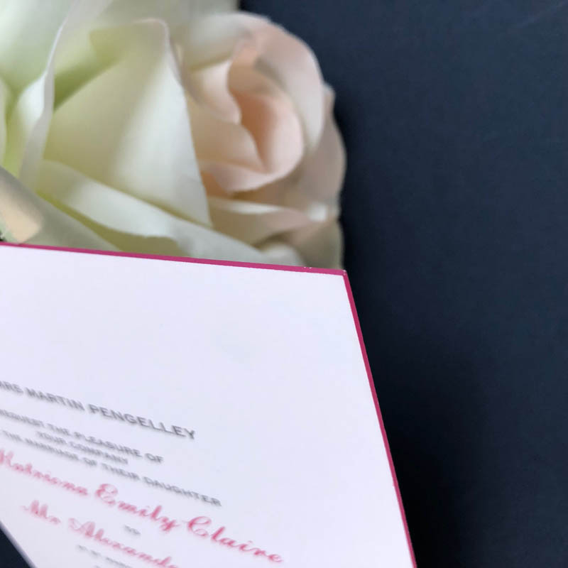 Pink edged wedding invitation